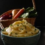 Instant Pot Mashed Potatoes and Parsnips in a turquoise bowl with basket of fresh vegetables in the background - Paint the Kitchen Red