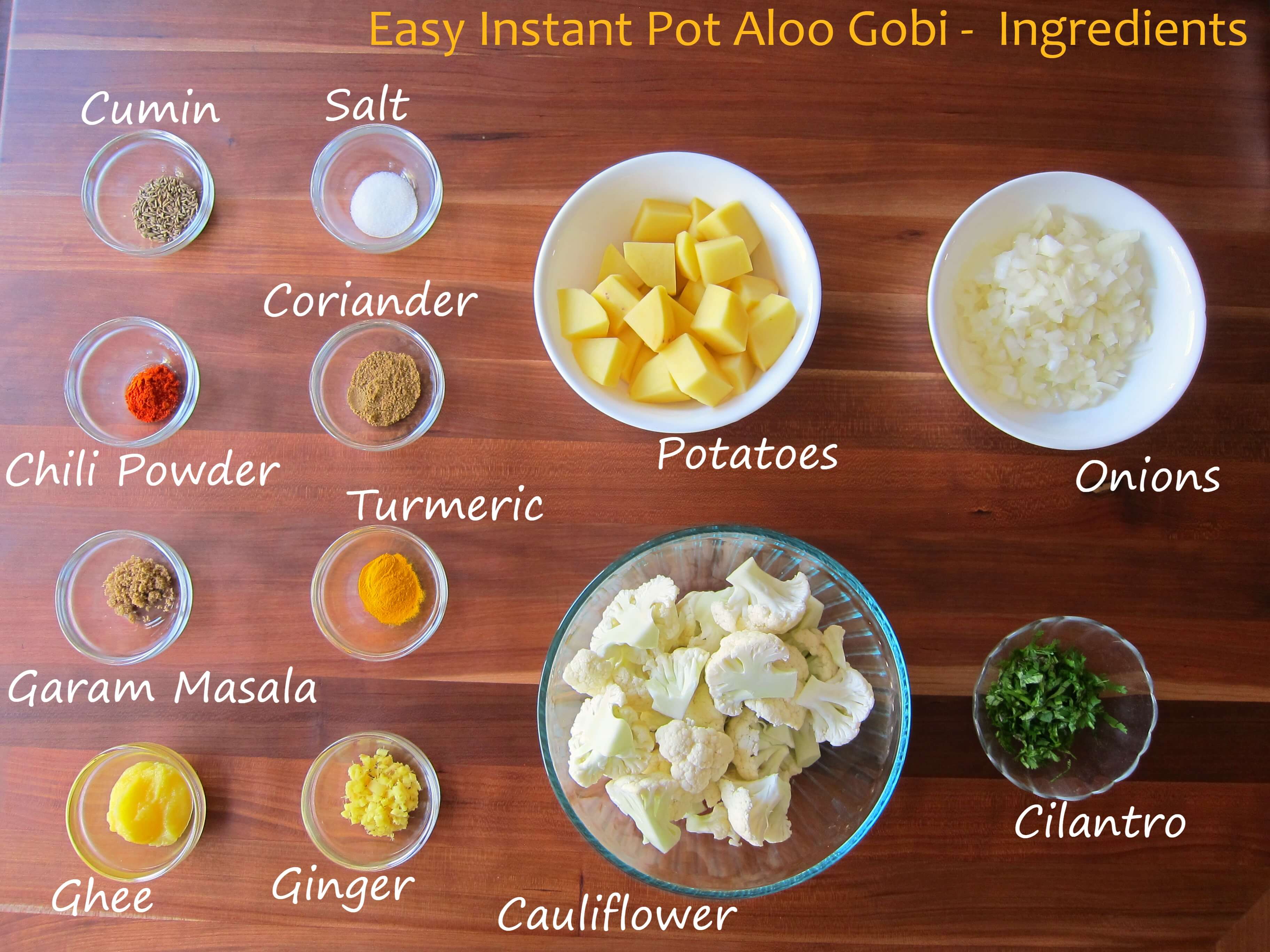 Instant Pot Aloo Gobi ingredients on a wooden countertop 