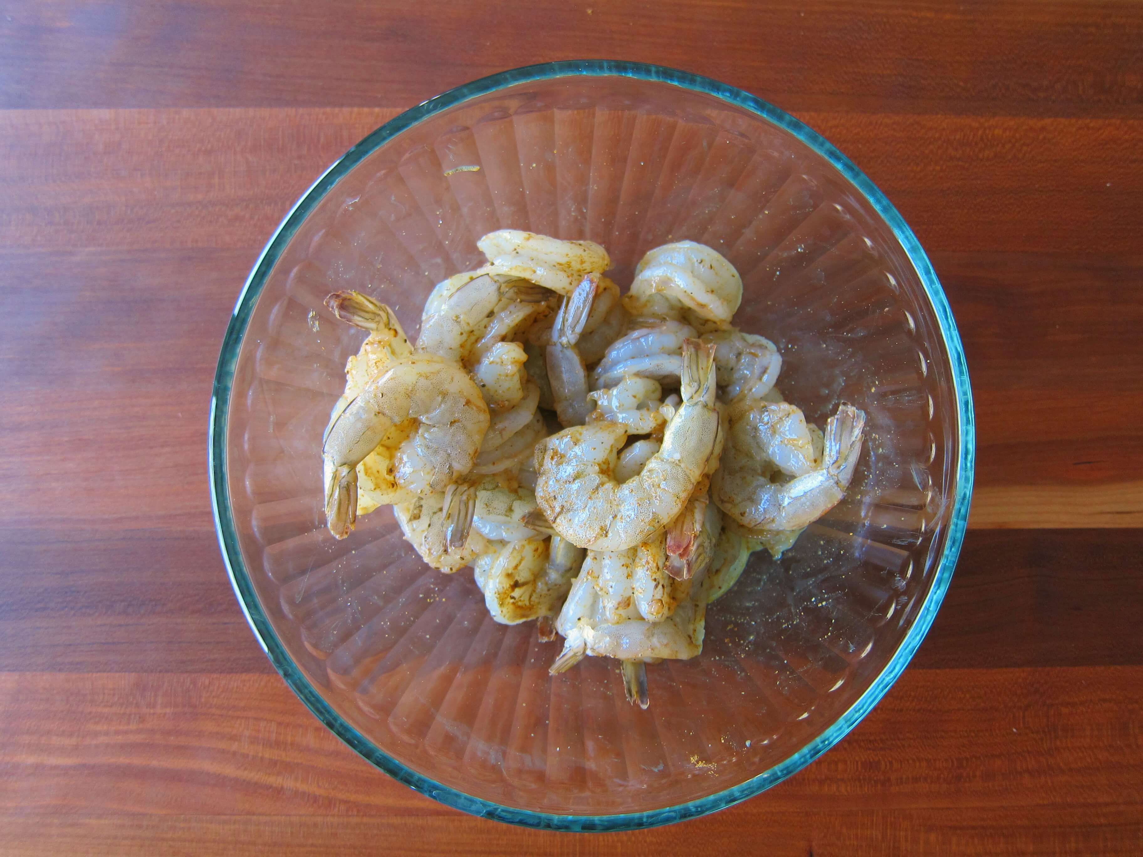 Glass bowl with marinated shrimp