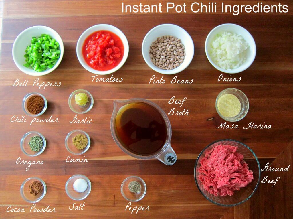 Instant Pot Chili Ingredients - Bell peppers, tomatoes, pinto beans, onions, chili powder, garlic, beef broth, masa harina, oregano, cumin, cocoa powder, salt, papper, ground beef - Paint the Kitchen Red
