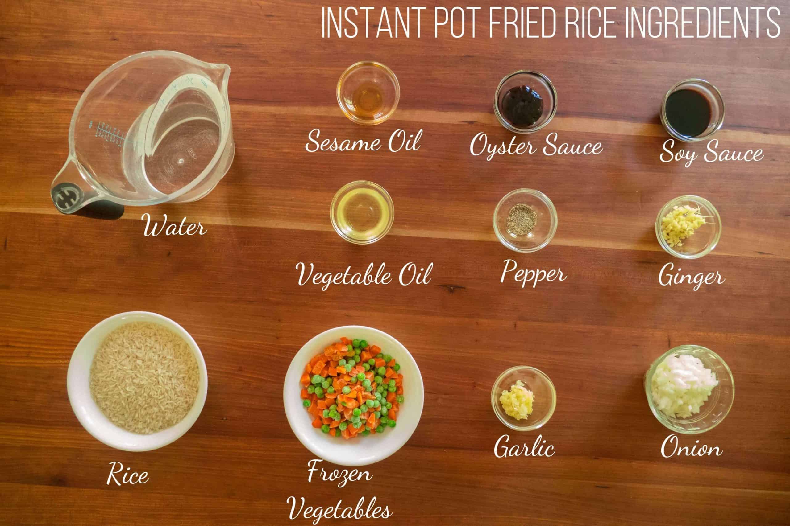 Instant Pot Fried Rice Ingredients - water, sesame oil, oyster sauce, soy sauce, vegetable oil, pepper, ginger, rice, frozen vegetables, garlic, onion