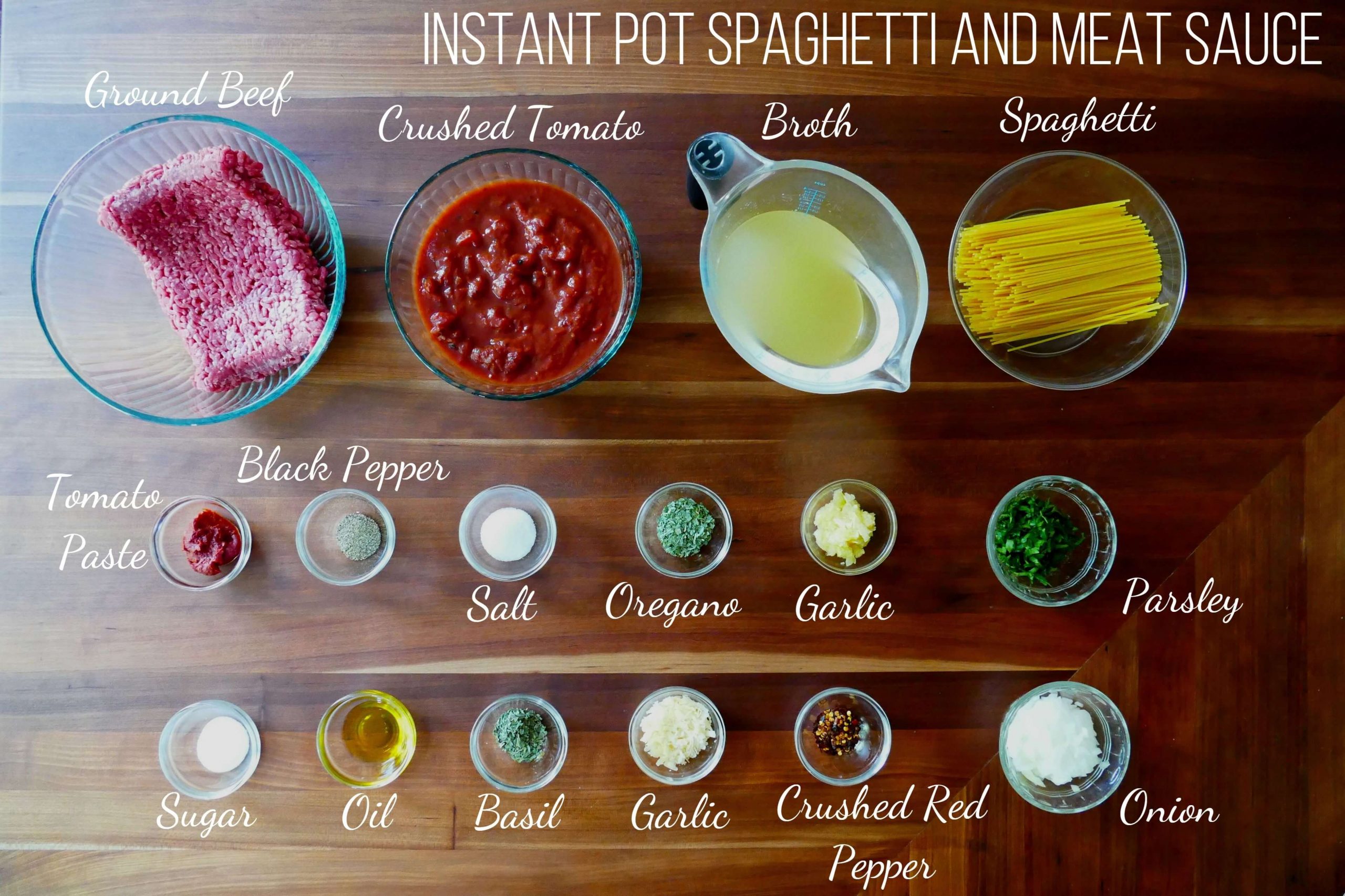Instant Pot Spaghetti and Meat Sauce Ingredients - ground beef, crushed tomato, broth, spaghetti, tomato paste, black pepper, salt, oregano, garlic, parsley, sugar, oil, basil, garlic, crushed red pepper, onion - Paint the Kitchen Red