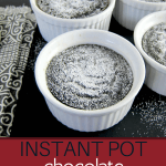 Instant Pot Chocolate Lava Cake pinterest pin - chocolate lava cake with sprinkled powdered sugar in white ramekins on a black background. From Paint the Kitchen Red