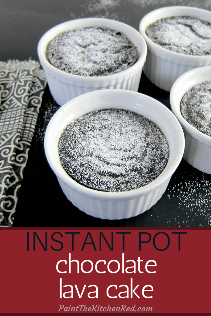Instant Pot Chocolate Lava Cake pinterest pin - chocolate lava cake with sprinkled powdered sugar in white ramekins on a black background. From Paint the Kitchen Red