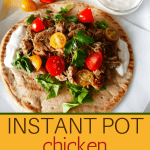 Instant Pot Chicken Shawarma Pinterest pin - shawarma on pita with white sauce and topped with tomatoes and parsley - Paint the Kitchen Red