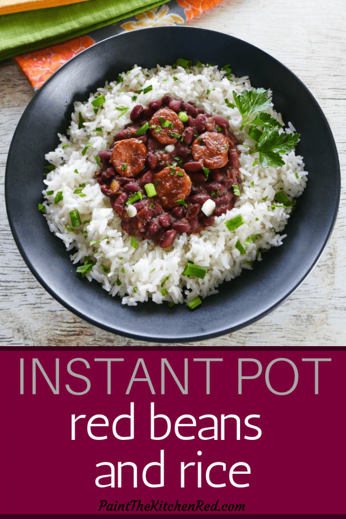 Instant Pot Red Beans and Rice Pinterest pin - bowl of rice with red beans and sausage on top garnished with parsley and green onions - Paint the Kitchen Red