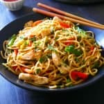 Instant Pot Thai Peanut Noodles in black bowl garnished with cilantro - Paint the Kitchen Red