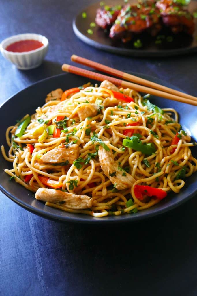 Instant Pot Thai Peanut Noodles in black bowl garnished with cilantro - Paint the Kitchen Red