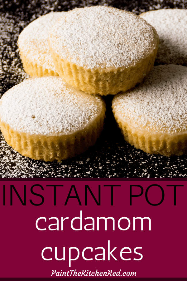 Instant Pot Cardamom Cupcakes Pinterest pin - Instant Pot Cupcakes stacked on a black background and dusted with confectioners sugar - Paint the Kitchen Red