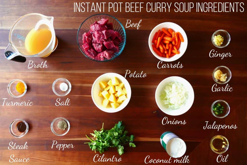 Instant Pot Beef Curry Ingredients - broth, beef, carrots, ginger, turmeric, salt, potato, onions, garlic, jalapenos, steak sauce, pepper, cilantro, coconut milk, oil - Paint the Kitchen Red