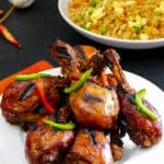 Instant Pot Korean Chicken - plate of grilled chicken with fried rice in background - Paint the Kitchen Red
