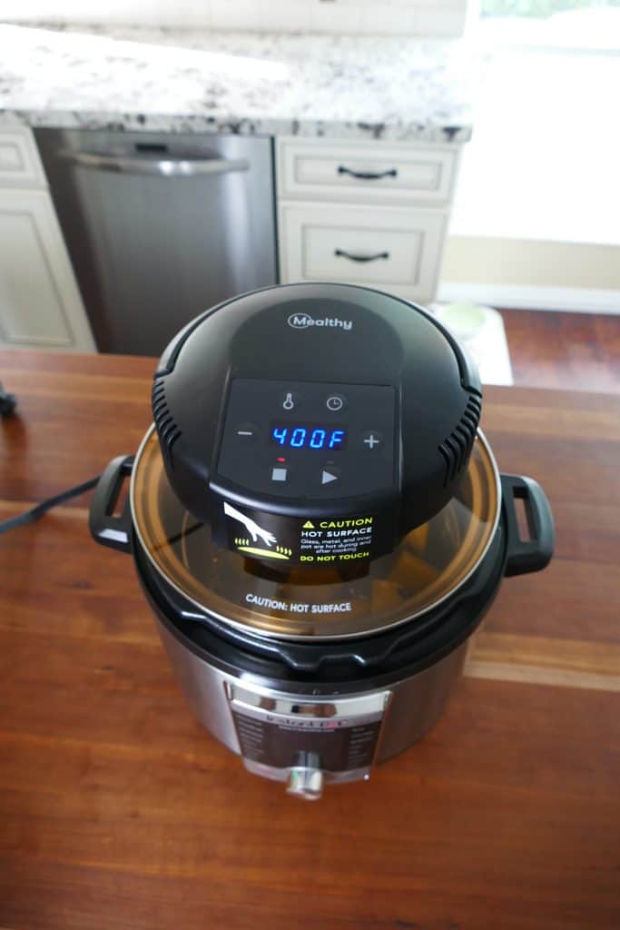 Potatoes can be seen through glass lid of Mealthy CrispLid on Instant Pot on Counter - Paint the Kitchen Red