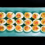 Wasabi Instant Pot Deviled Eggs with wasabi and pickled ginger on colorful blue plate - Paint the Kitchen Red