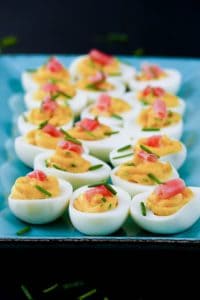 Wasabi Instant Pot Deviled Eggs with wasabi and pickled ginger on colorful blue plate - Paint the Kitchen Red