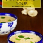 2 Asian-print bowls of Instant Pot Thai coconut soup with herbs in the background Pinterest pin - Paint the Kitchen Red