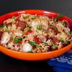 Instant Pot Jambalaya in orange bowl with shrimp, sausage and rice - Paint the Kitchen Red