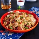 Instant Pot Jambalaya in orange bowl with shrimp, sausage and rice - Paint the Kitchen Red