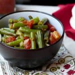 Instant Pot Green Beans Middle Eastern Style in brown bowl with tomatoes on top - Paint the Kitchen Red