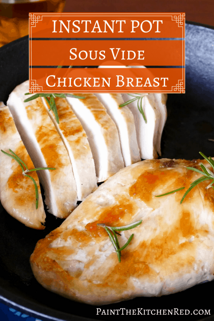 Instant Pot Sous Vide Chicken Breast - Two pieces of chicken, one sliced in a cast iron pan with rosemary - Paint the Kitchen Rred