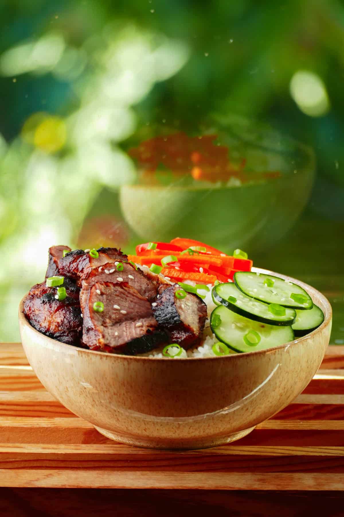 Instant Pot Char Siu - Chinese bbq pork in a bowl with rice, cucumbers and bell peppers