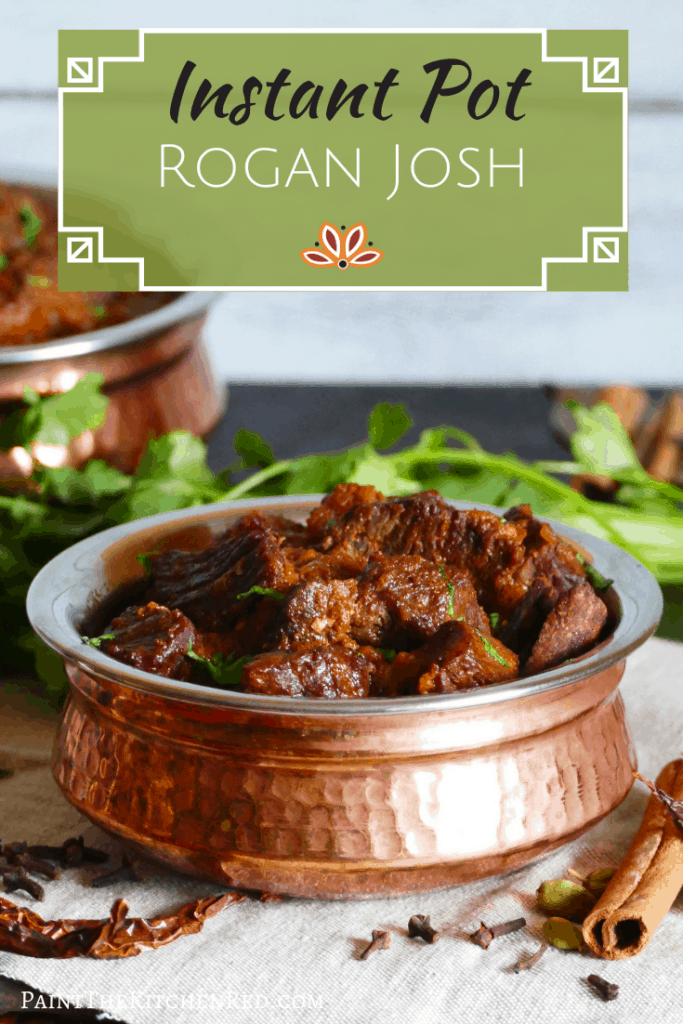 Instant Pot Rogan Josh in a copper dish with whole spices and cilantro in background