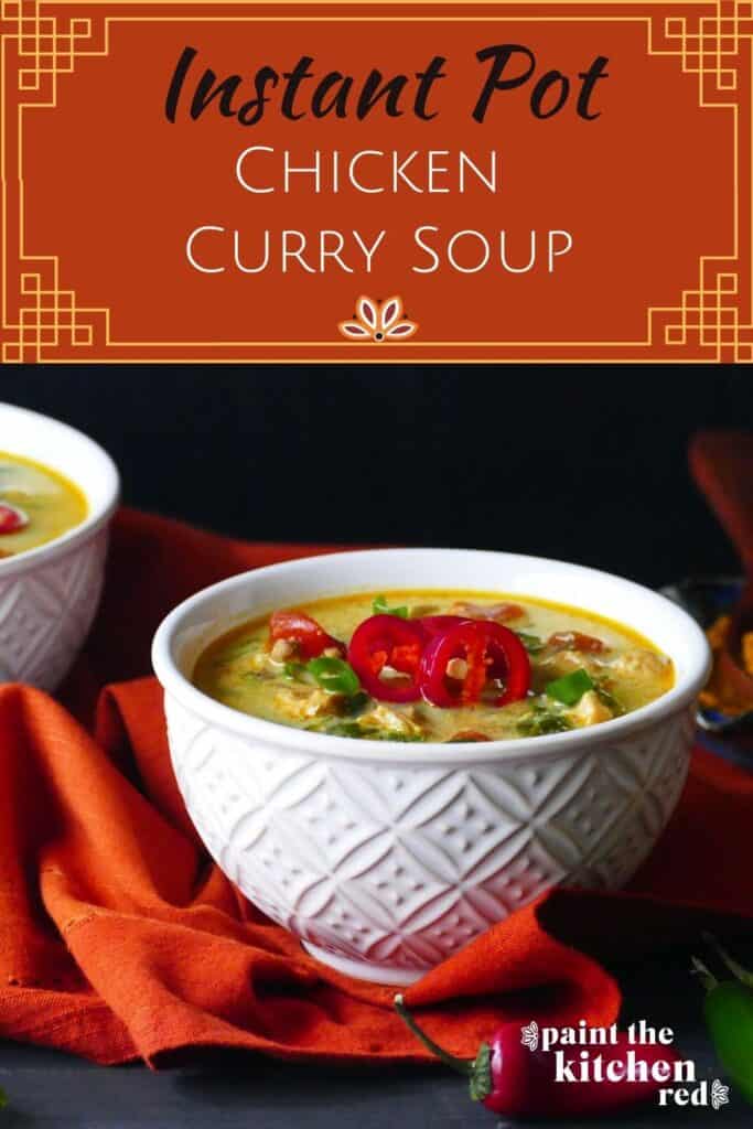 Instant Pot Chicken Curry Soup Pinterest Pin - Two white bowls of yellow colored chicken curry soup garnished with red jalapenos and green onions on an orange napkin