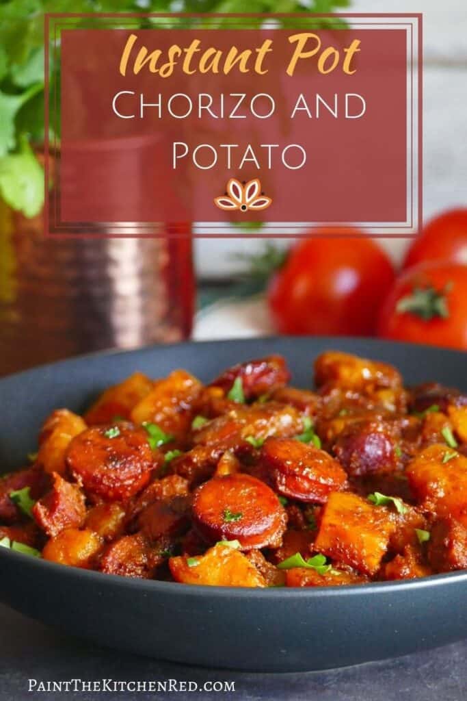 Instant Pot chorizo and potato Pinterest pin - Black round serving dish with chorizo and potato sprinkled with cilantro and copper mug with fresh cilantro and fresh tomatoes in background