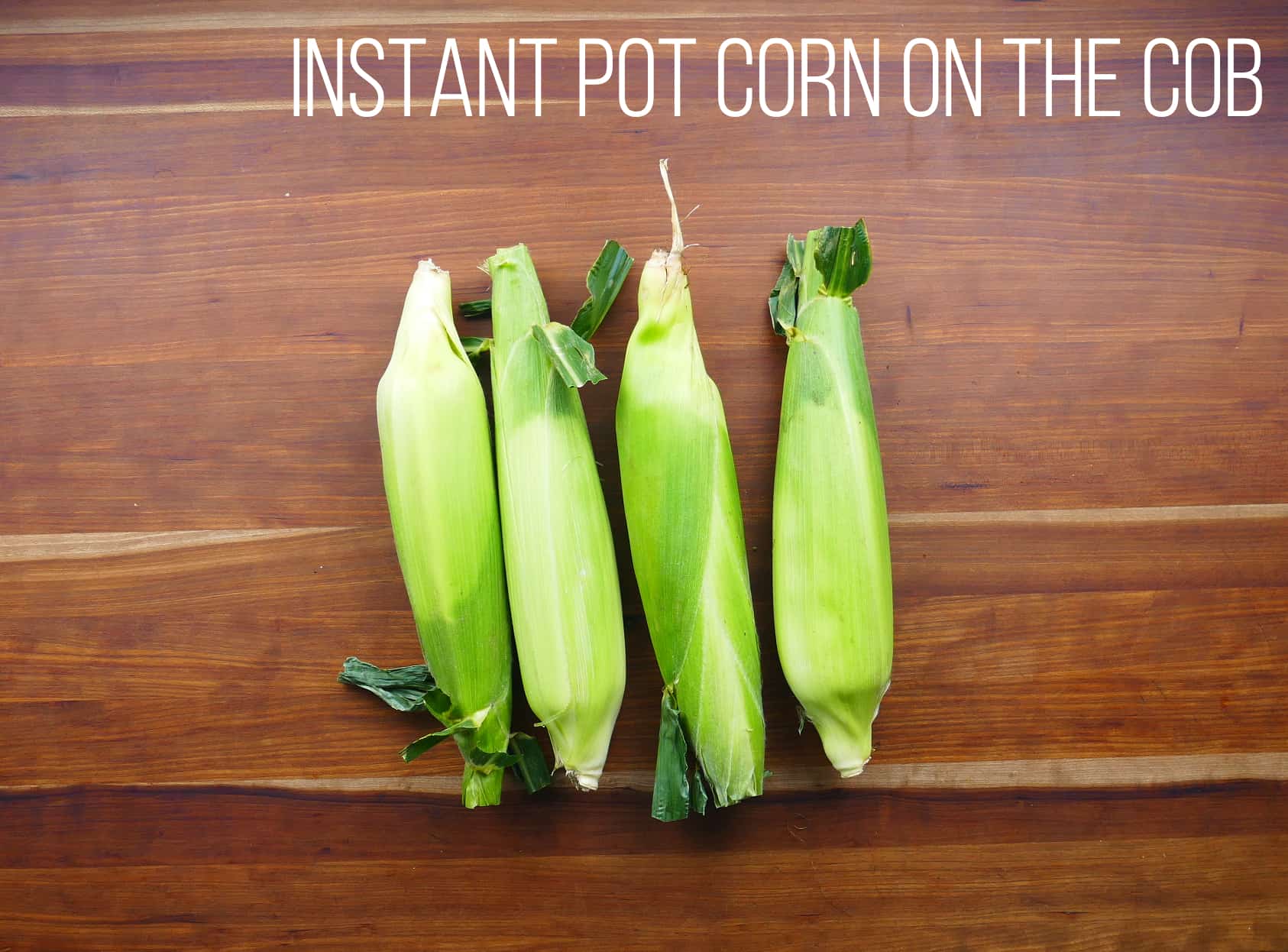 Instant Pot corn on the cob - four ears of corn in husk