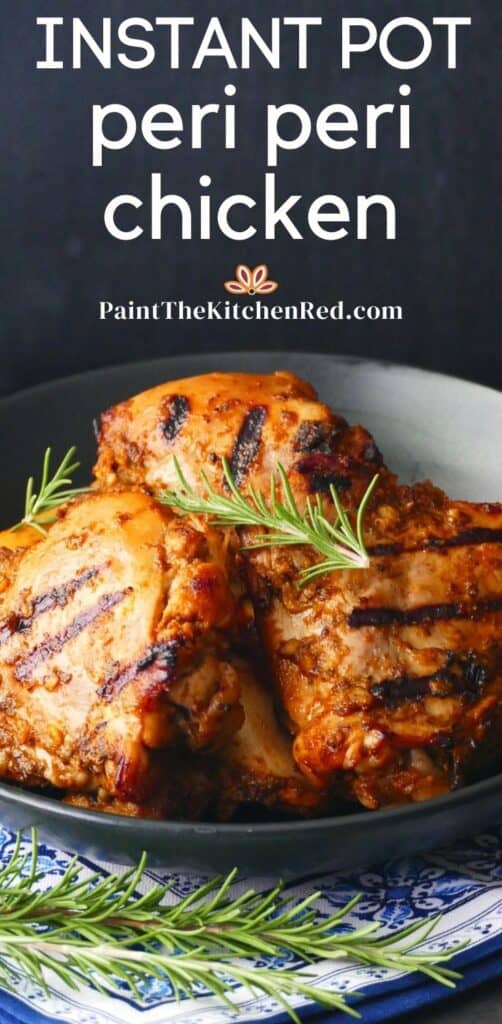 Instant pot peri peri chicken paintthekitchenred dot com - Grilled peri peri chicken pieces stacked in black plate on blue and white napkin with rosemary garnish