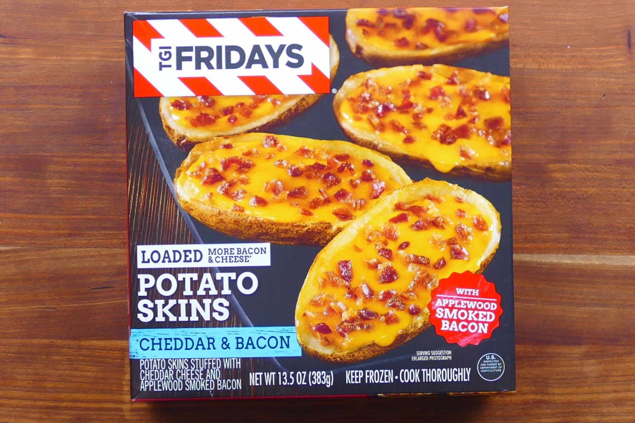 TGI Friday's loaded potato skins with cheddar and bacon in box on wooden background