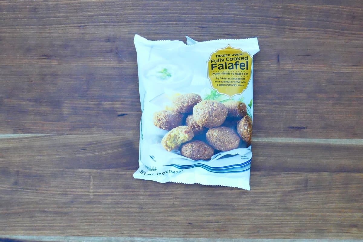 Bag of Trader Joe's fully cooked falafel on wooden background