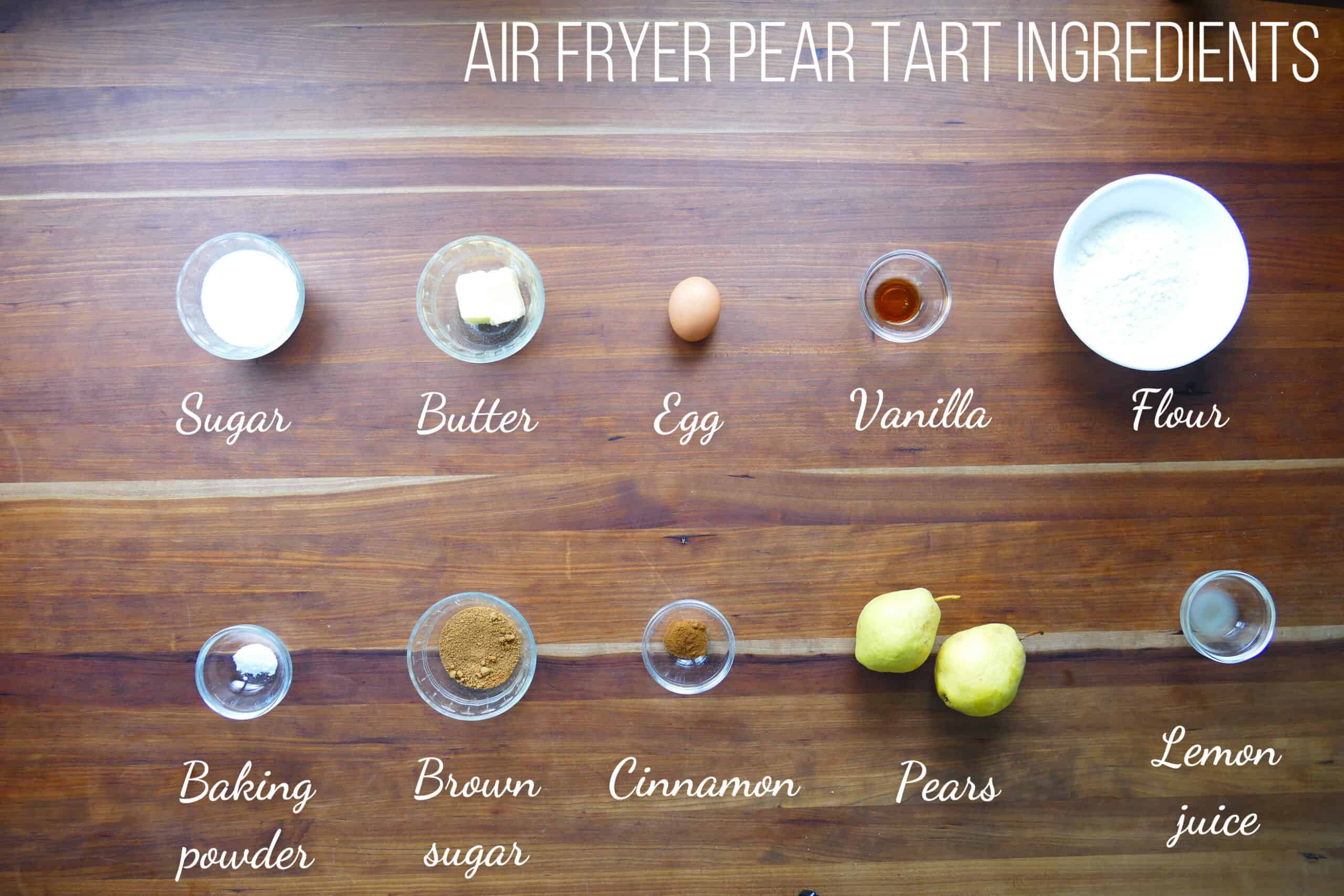 Air fryer pear tart ingredients on wooden counter