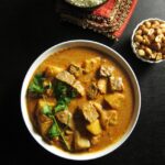 white bowl with beef and potatoes massaman curry