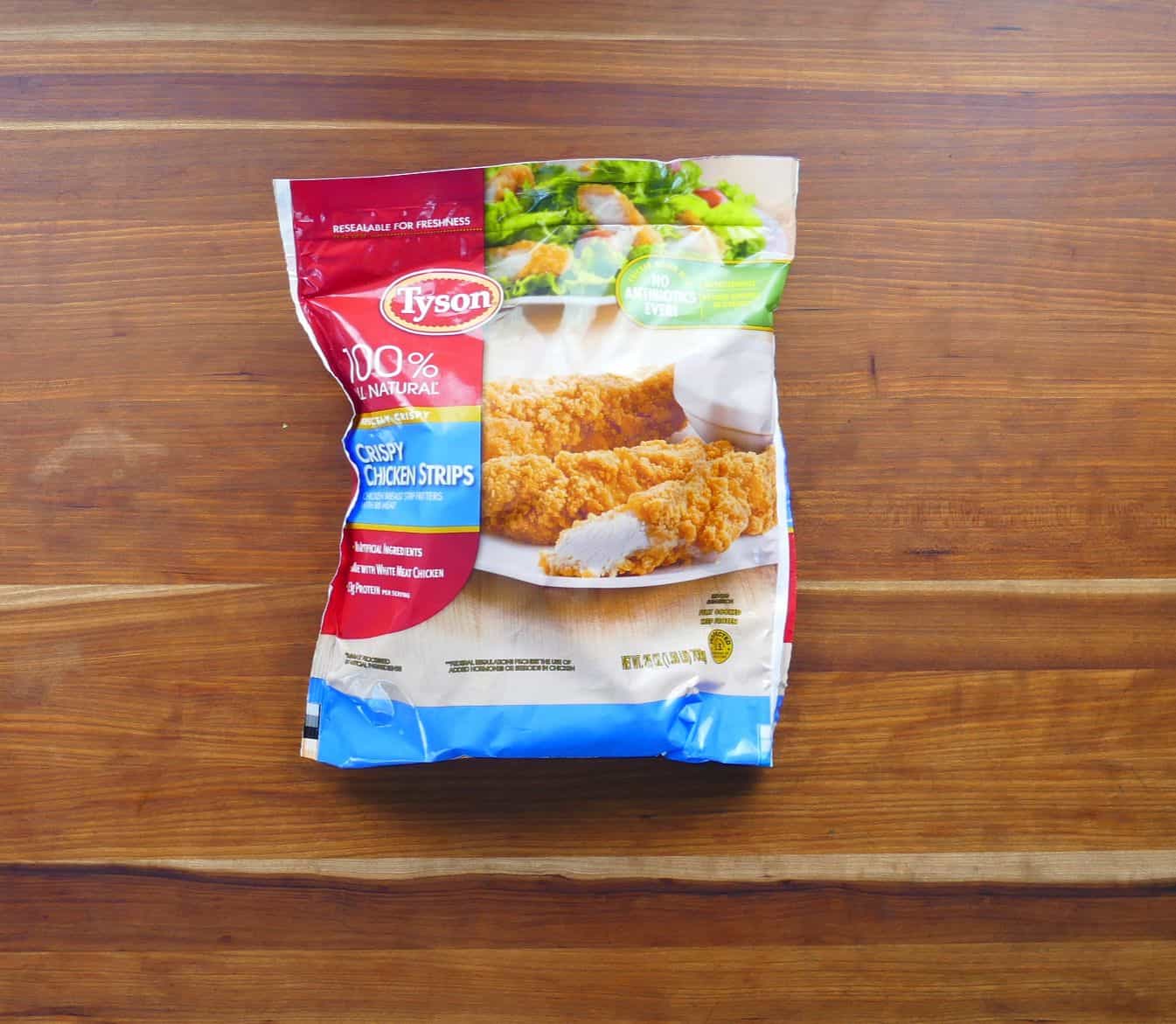 Tyson crispy chicken strips bag on wooden counter