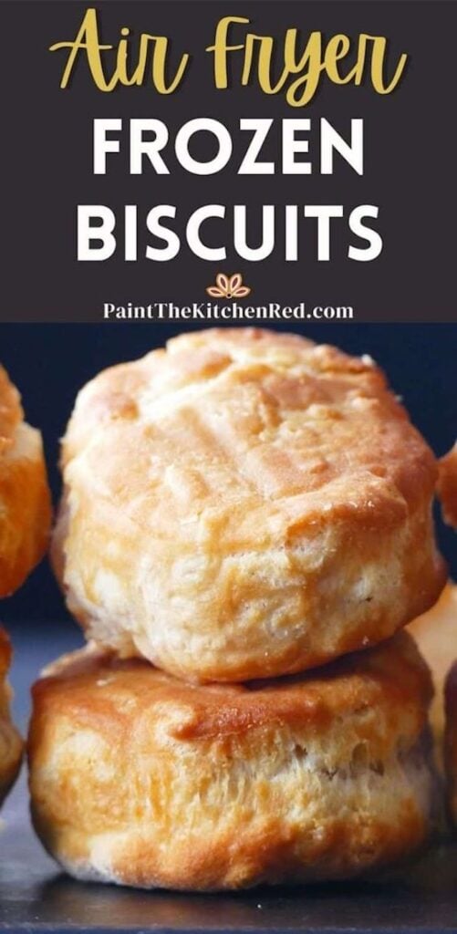 Golden biscuits stacked on a dark surface and text "air fryer frozen biscuits".