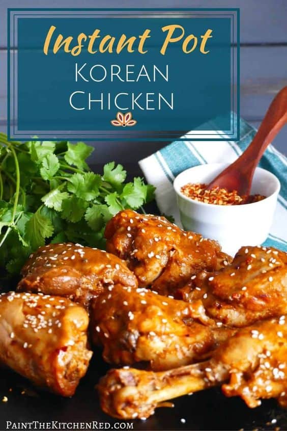 Instant Pot Korean Chicken two thighs and four drumsticks on a dark background, garnished with sesame seeds with text 