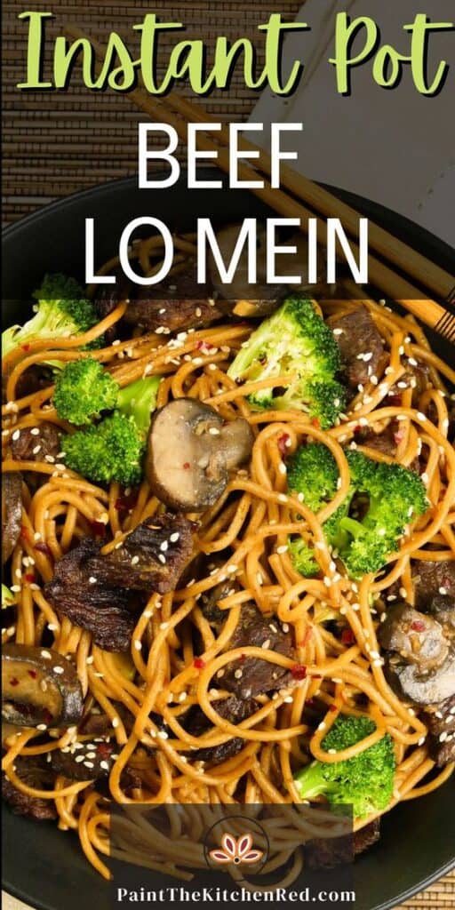 Instant Pot Lo Mein with Beef and Broccoli in black bowl on straw mat with chopsticks laid across bowl.