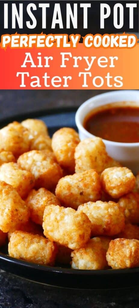 Tater tots stacked on a dark plate with a bowl of red sauce with text 