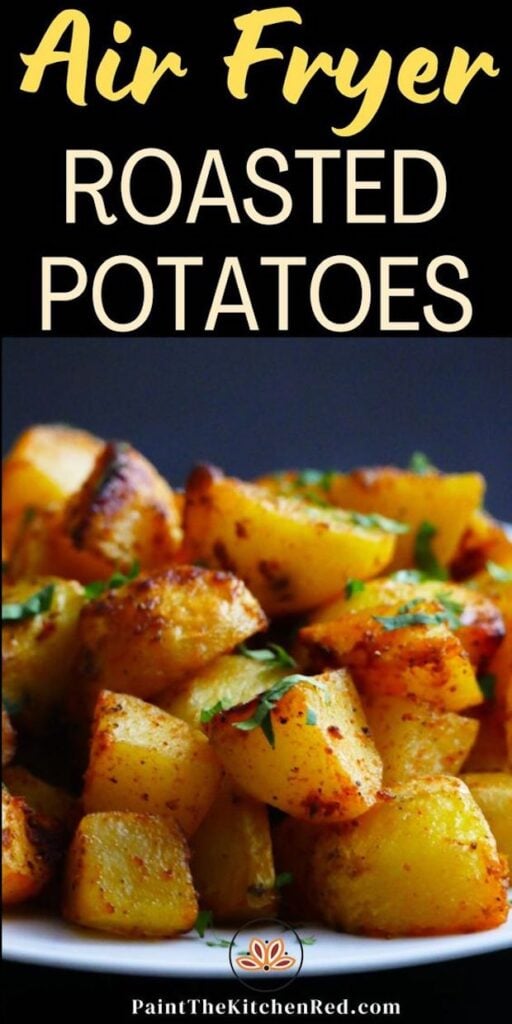 White plate with crispy golden potatoes stacked and garnished with parsley with text "air fryer roasted potatoes"