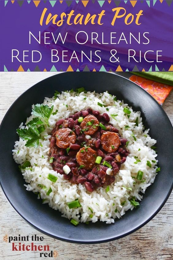 Instant Pot Red Beans and Rice Pinterest pin - bowl of rice with red beans and sausage on top garnished with parsley and green onions.