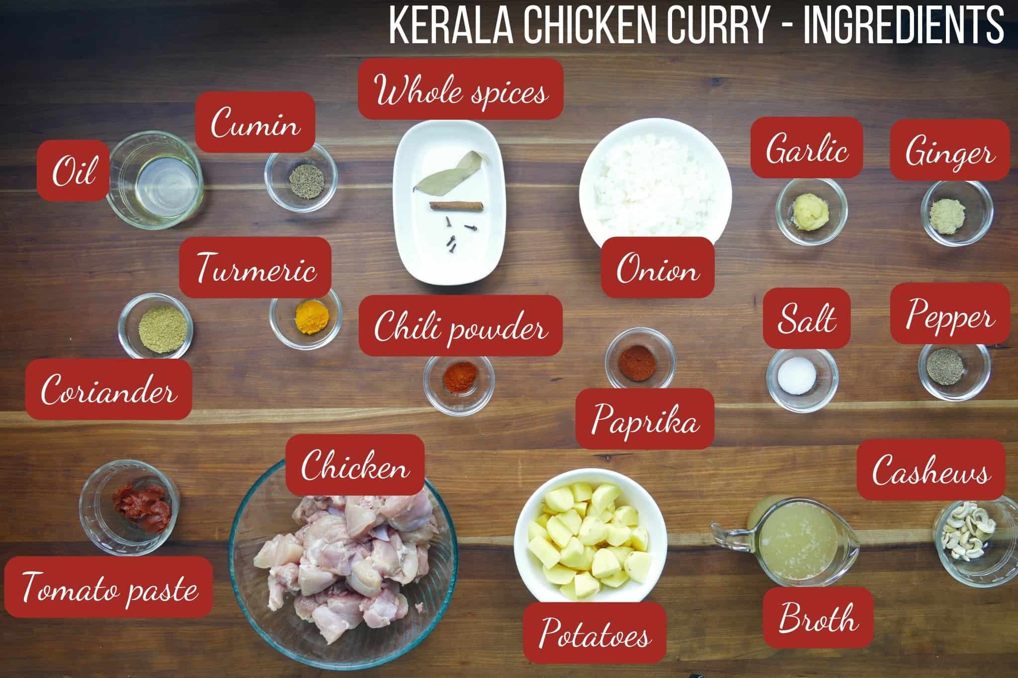 Kerala Chicken Curry ingredients in bowls on wooden background.