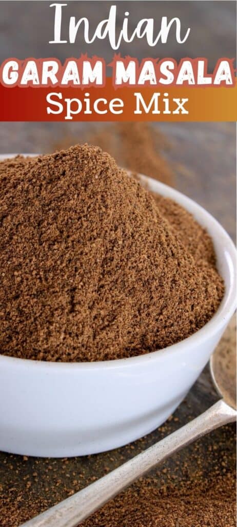 Garam masala in a bowl heaping mound with text 