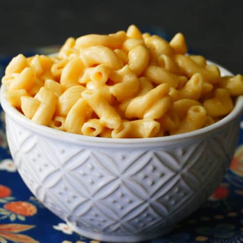 Instant Pot Mac and Cheese heaped in white bowl.
