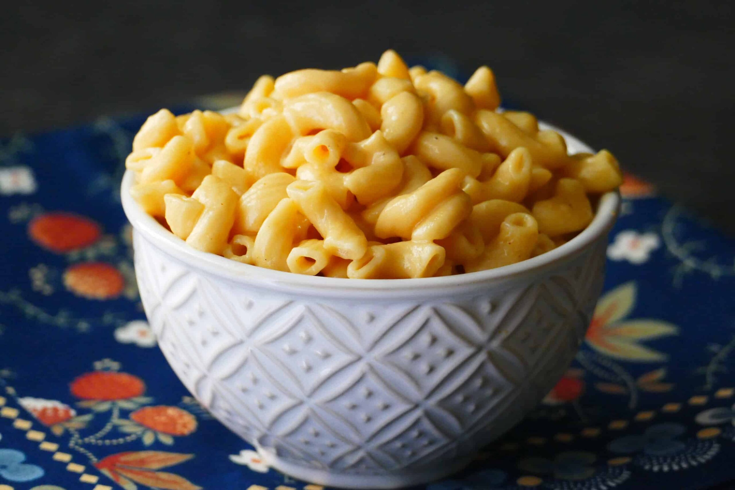 Instant Pot Mac and Cheese heaped in white bowl.