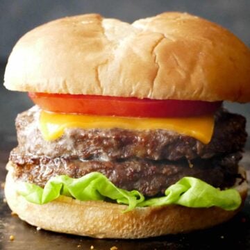 Air Fryer Frozen Burger - 2 patties on bun with lettuce, cheese, and tomato.