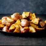 Air Fryer red potatoes stacked in plate