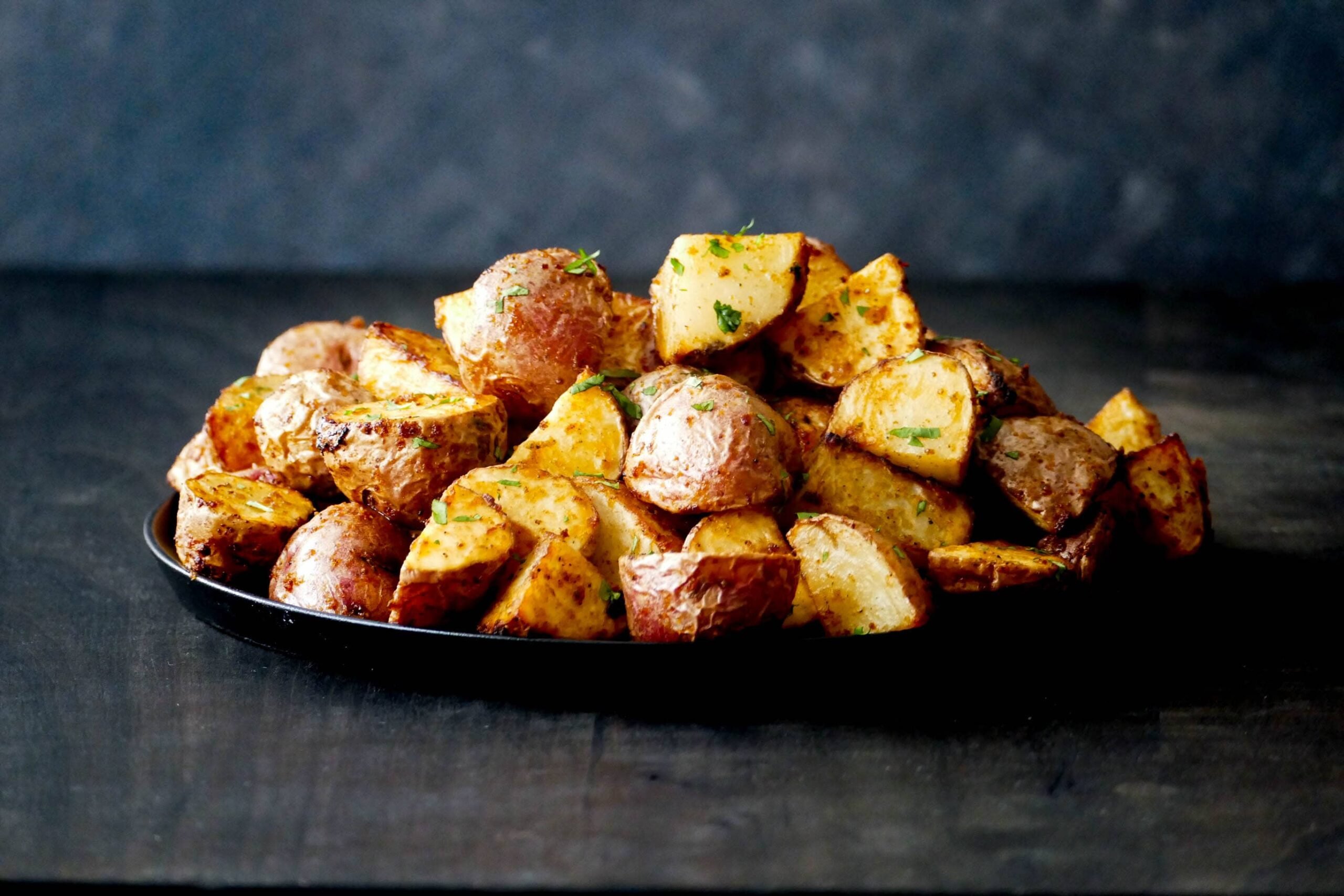 Air Fryer red potatoes stacked in plate