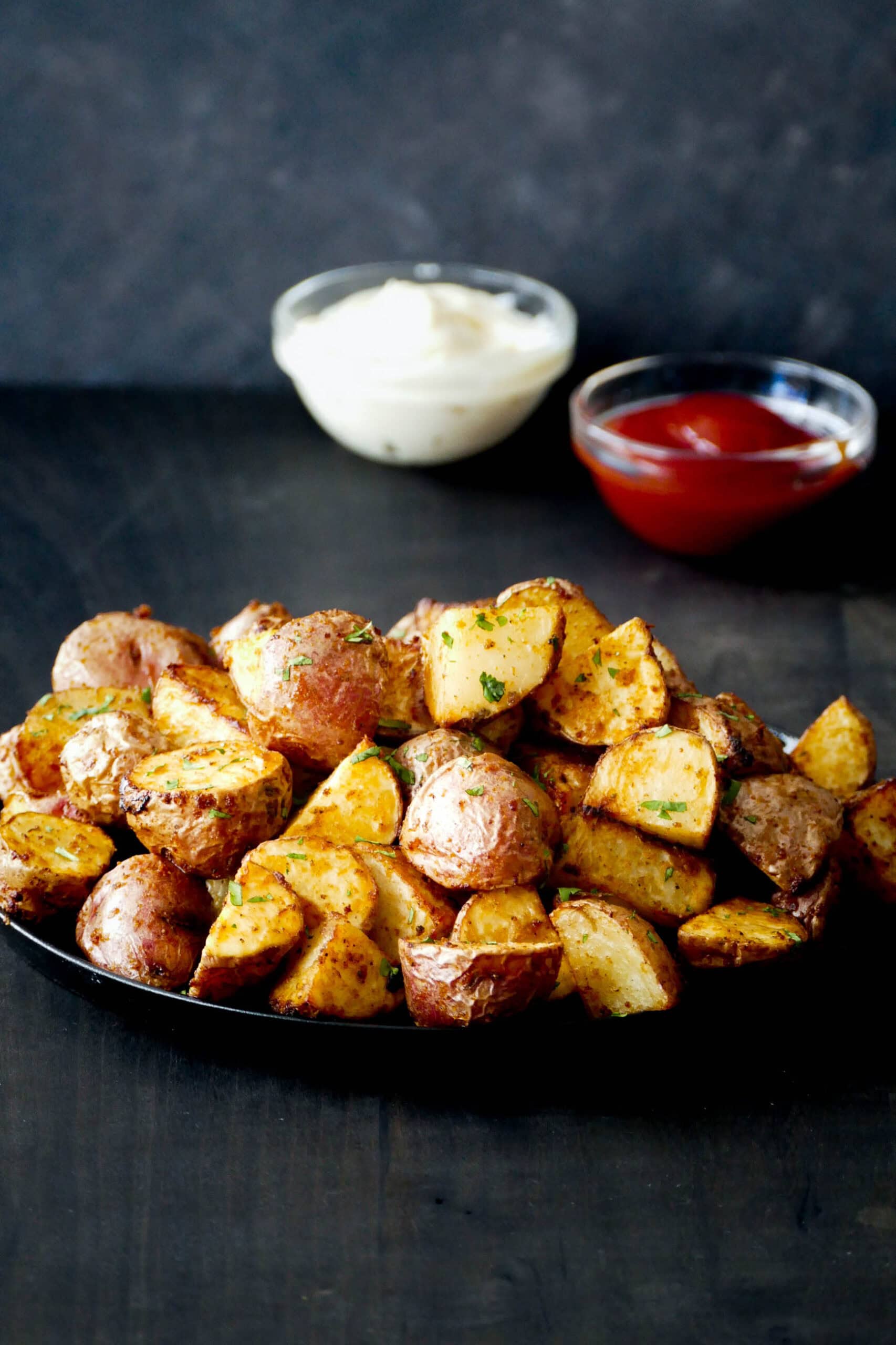 Air Fryer red potatoes stacked in plate