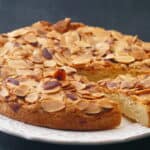 Swedish visiting cake on a plate with piece cut.