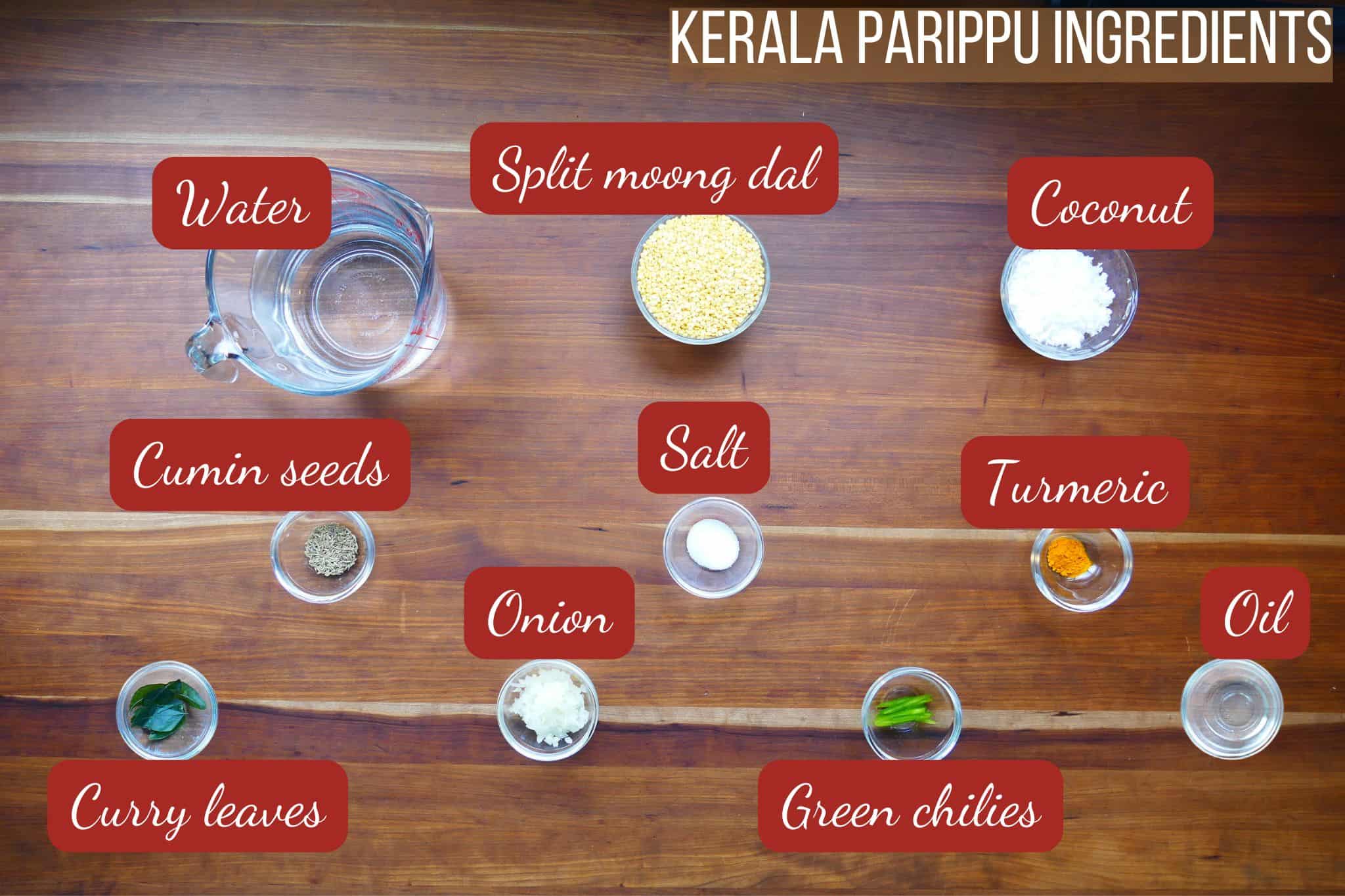 Keralal parippu ingredients on wooden counter.